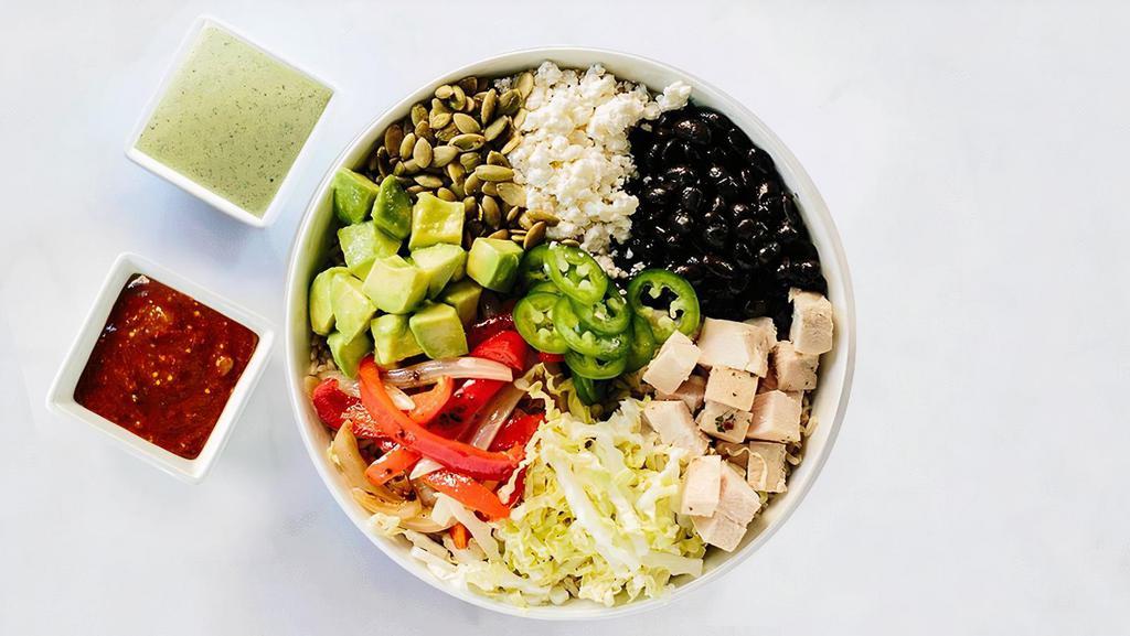 Fiesta Bowl · Brown rice, roasted chicken, avocado, Napa cabbage, jalapeño, black beans, fajita peppers and onions, queso fresco, pepitas, roasted tomatillo salsa, lime squeeze, and jalapeño vinaigrette. (725 calories)