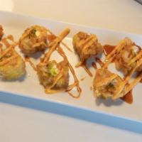 Pop This Roll (Fried) · In - salmon, cream cheese, avocado, masago In soy paper, tempura. Sauce - spicy mayo and swe...