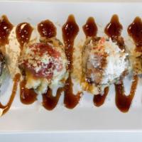 Uptown Roll · In - kani, cream cheese lightly tempura fried. Out - spicy tuna and snow crab mix. Sauce - e...