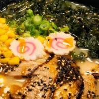 Ramen · Noodle soup with wakame, sweet corn, green onions, fish cake & sesame seeds.