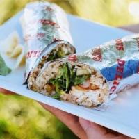Spicy Salmon Wrap · Spicy salmon, avocado, field greens and cucumber wrapped in soy paper with spicy mayo