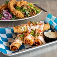 Firecracker Taquitos · Chicken strips, queso blanco, fried onions and jalapeños, and spicy sour cream.