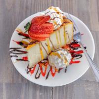 Maggie'S Cheesecake · Rich and creamy extra tall Maggie's Cheesecake