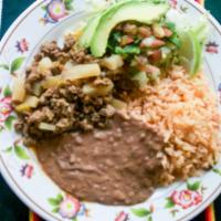 Picadillo Plate · Picadillo (Ground Beef with Potatoes) served with Mexican Rice, Refried Beans, Salsa, Lettuc...