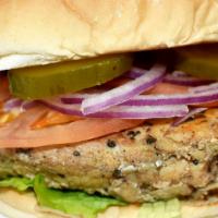 Grilled Chicken Sandwich · Comes with lettuce, tomato, pickles and onions with your choice of flavor.