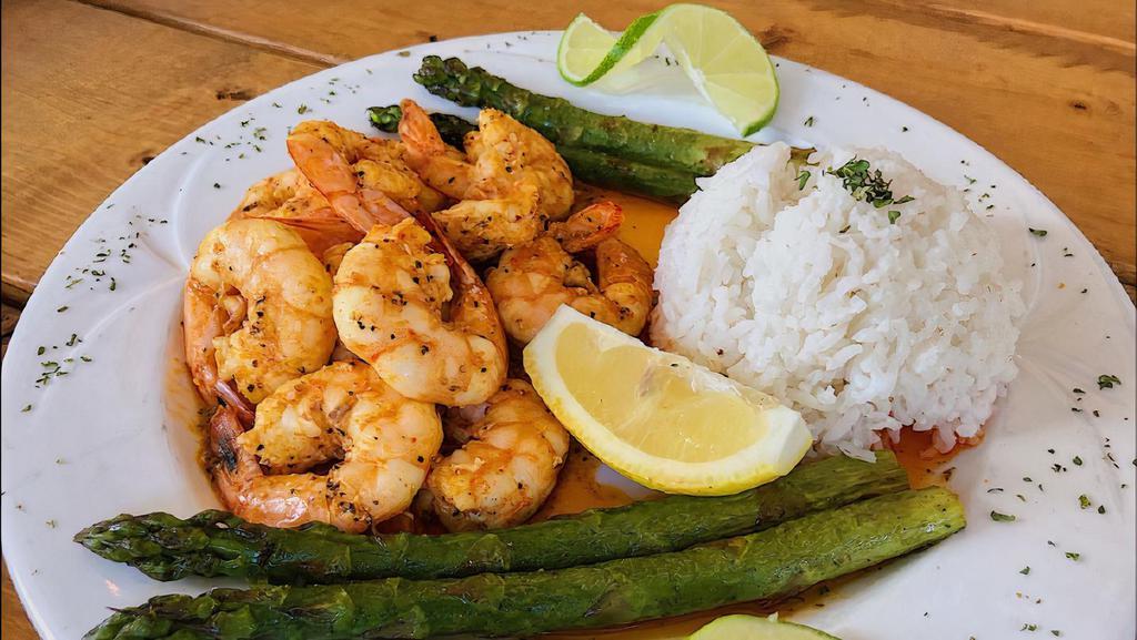 Big Easy Shrimp Plate · 12 pieces. Garlic butter, lemon pepper, Cajun, or Sunset Bang shrimp plate. Served with dirty rice or steamed rice and asparagus or broccoli.