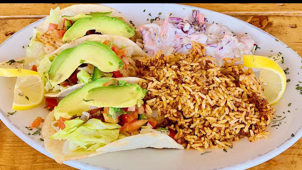 Fish Tacos · 3 pieces. Fresh crispy or grilled catfish with pico de gallo, lettuce, and Cheddar cheese. Served on flour or corn tortillas with dirty rice or steamed rice and coleslaw.