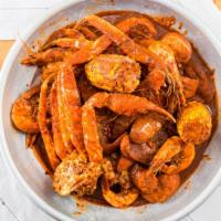 Shrimp, Snow Crab, And Sausage · 1 lb of Shrimp, 1 lb of Snow Crab, and 1/2 lb of sausage with red potatoes(3) and corn(2)