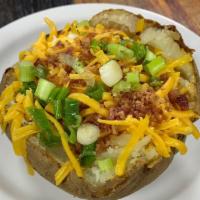 Baked Potato · Comes with butter, cheese, sour cream, bacon bits and chives.