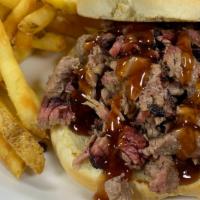 Brisket Sandwich W/ One Side · Your choice of sliced or chopped brisket on a toasted bun.