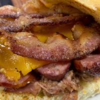 Triple Threat W/ One Side · Pulled pork, spicy sausage & peppered bacon w/ melted cheddar cheese on a jalapeño cheese bun.