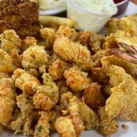 Crawfish & Shrimp Combo · Fried Louisiana crawfish tails & 4 jumbo fried shrimp with your choice of two sides.