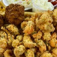 Fried Crawfish Tails · Fried Louisiana crawfish tails with hushpuppies and your choice of two sides.