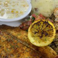 Pan Seared Redfish & Grilled Shrimp · Texas redfish pan seared & 4 jumbo Gulf grilled shrimp over wild rice.