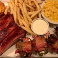 Pork Ribs & Bar-B-Que Poppers · 3 slow-smoked pork ribs with 2 brisket poppers & 2 sausage poppers