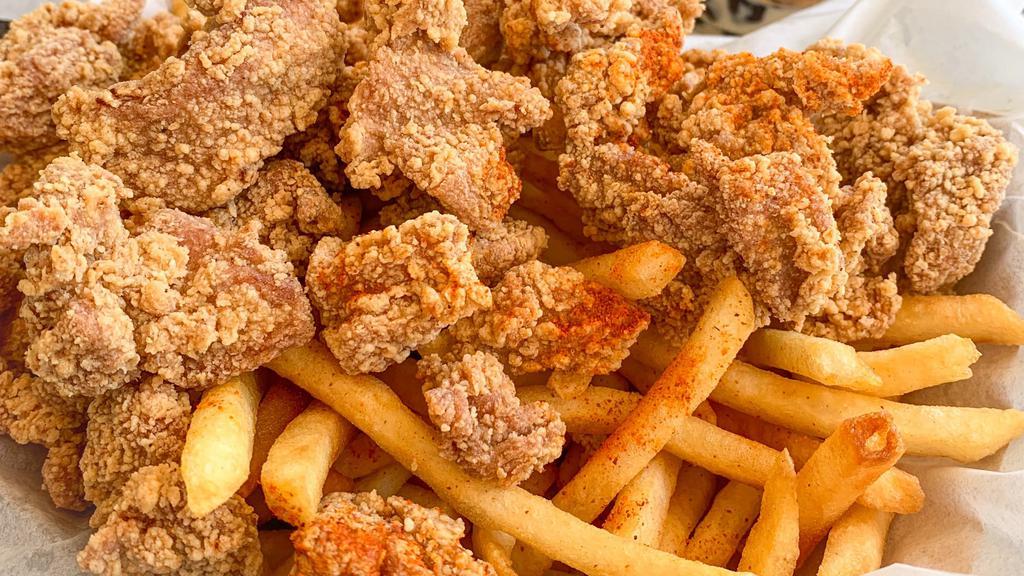 Popcorn Chicken & French Fries · Marinated bite sized chicken served with french fries.