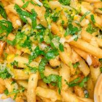 Garlic Fries · Crispy fries topped with garlic seasoning shredded mozzarella cheese and cilantro.