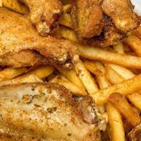 Cajun Wings & French Fries · Chicken wings and french fries seasoned with a blend of cajun spices.