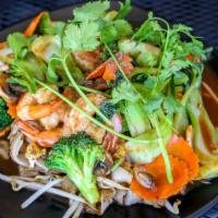 Street Chow Fun · Flat rice noodles stir fried with baby bok choy broccoli and carrots.