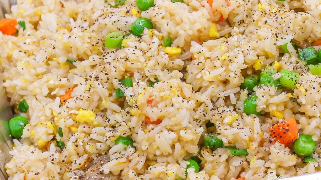 Chicken Fried Rice · Fried rice made with carrots peas green onion eggs and chicken.