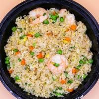 Combination Fried Rice · Fried rice made with carrots peas green onion eggs shrimp chicken and beef.