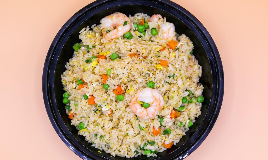 Combination Fried Rice · Fried rice made with carrots peas green onion eggs shrimp chicken and beef.
