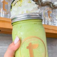Matcha Green Tea Smoothie · Blended matcha green tea topped with whipped cream and matcha powder.