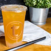 Tropical Tease · Passion fruit and mango green tea hand shaken with ice served with lychee jelly.