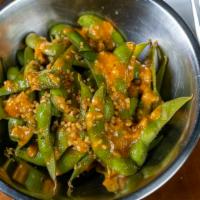 Edamame · soybeans tossed in house mild garlic butter sauce