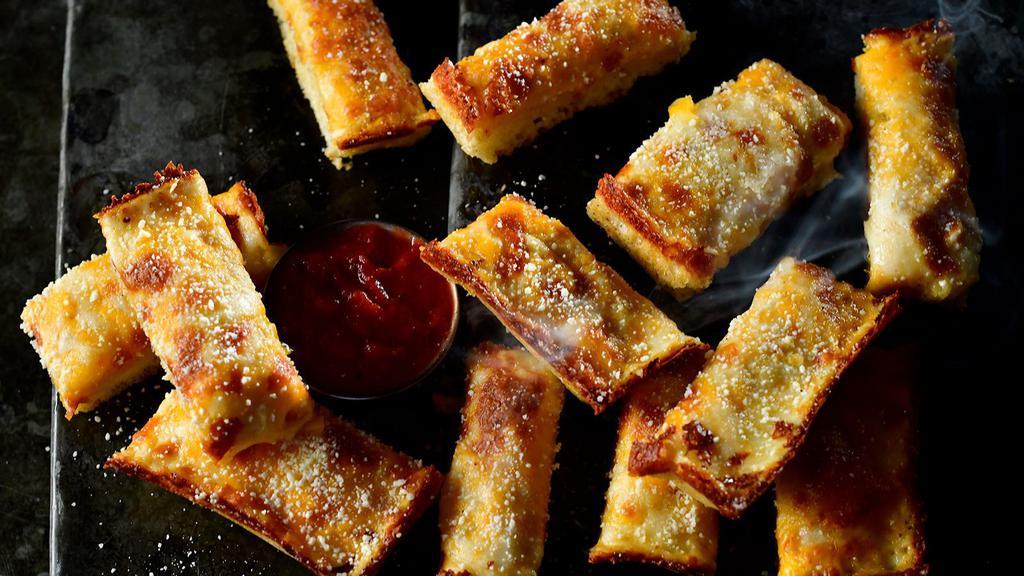 Jet'S Triple Cheese Turbo Stix · Twelve pieces baked bread with mozzarella and Cheddar cheese. Topped with butter, garlic, and Romano cheese. Includes pizza sauce.
