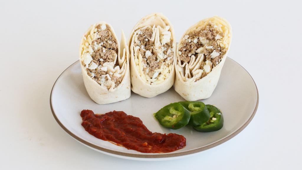 Egg White Turkey Sausage Breakfast Burrito · Egg whites mixed with homemade lean turkey sausage. Wrapped in a flour tortilla with a touch of cheese and fresh salsa.