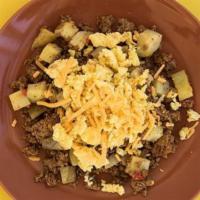 Eggs Over Turkey Hash · Fluffy scrambled cage free eggs served over a house made turkey sausage and potato hash with...
