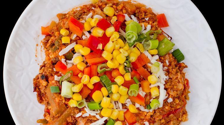 Turkey Nacho Casserole · Lean ground turkey meat, corn tortilla chips, tomatoes, bell peppers, cheddar and jack cheeses mixed with Texas spices and baked to gooey perfection!