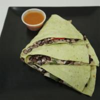 Black Bean Fiesta Quesadilla · Black beans, quinoa, roasted peppers and onions and melted Jack cheese in a spinach tortilla...