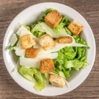 Caesar Salad · A roman classic with leafy greens, shaved Parmesan cheese, and croutons. Tossed in classic C...