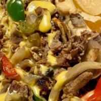 South Philly Chimichanga · Beef or Chicken, Grilled Onions, Mushrooms, Bell Peppers, Texadelphia Cheese Whiz Wrapped in...