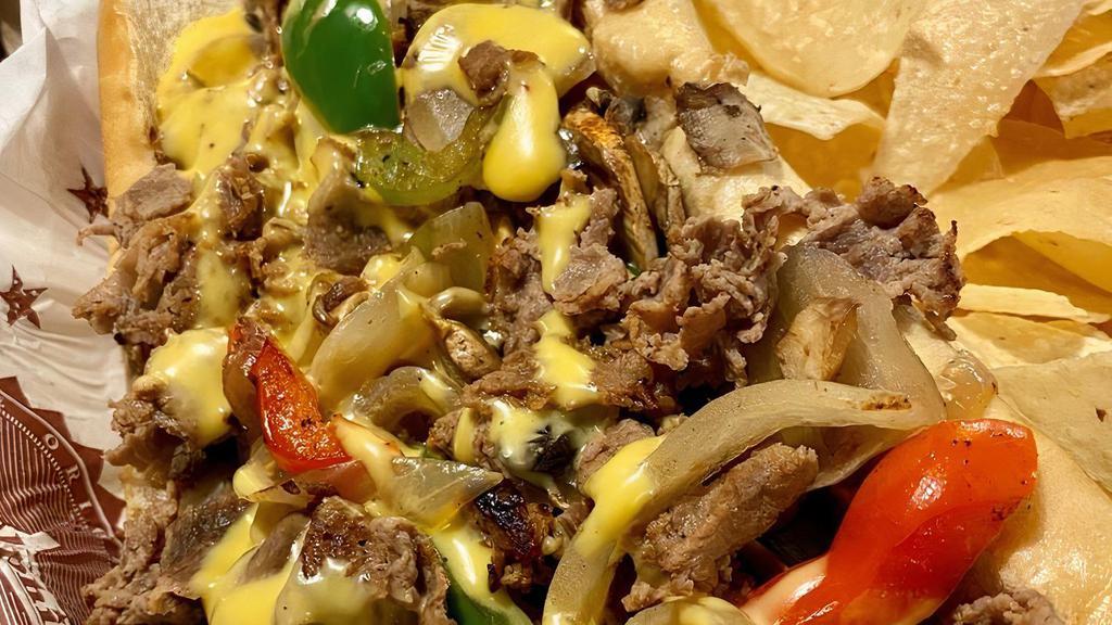 South Philly Chimichanga · Beef or Chicken, Grilled Onions, Mushrooms, Bell Peppers, Texadelphia Cheese Whiz Wrapped in a Southwest Tortilla and Deep Fried to Perfection.