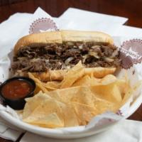 Build Your Own Cheesesteak · Choose from beef or thinly sliced chicken breast grilled with onions and mozzarella cheese t...
