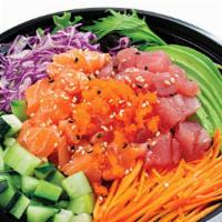 Hwaedupbap (Chirashi Bowl) · Cubed salmon, tuna, and veggies on top of sushi topped with fish eggs.