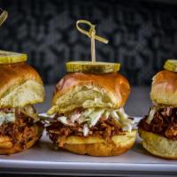 Pulled Pork Sliders · BBQ pulled pork and citrus slaw. Served with one side.