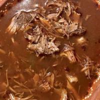 Birria Bowl · Guisado de carne cocinado en salsa adobo y servido con caldo de consomé / Meat stew cooked i...