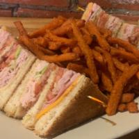 Club Sandwich · Toasted bread, sliced smoked turkey and ham, plus bacon, lettuce, tomato, and mayonnaise. Se...