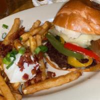 Santa Fe Burger · Poblano and jalapeno peppers, grilled with caramelized onions, pepper jack cheese, and haban...