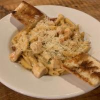 Spicy Chicken & Shrimp Pasta · Penne pasta tossed in our creamy Cajun alfredo sauce with sautéed green onions, shrimp, and ...