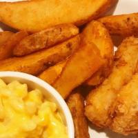 Fish & Chips · Beer battered white flaky fish, served with a garnish of coleslaw, homemade tartar sauce, an...