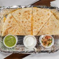Quesadilla · Fire braised chicken, steak, al pastor pork, or 2 tamales – your choice of 4 or 8 slices gri...