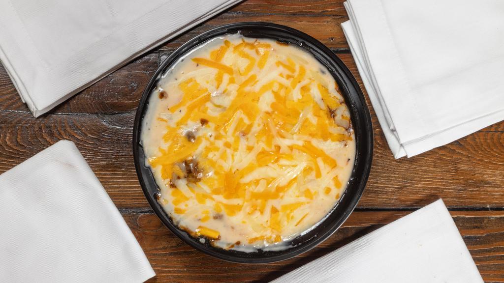 Tamale Pie (1) · Fritos, TX beef chili, queso, and your choice of 1 tamale. Topped with shredded cheese. Nothing like a good ole frito pie !! Yum.