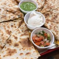 Kids Quesadilla · Fire braised chicken, al pastor pork, or steak. Served with rice and sour cream.