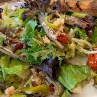 Greek · California spring mix lettuce, vine-ripened tomatoes, Feta cheese, red onions, pepperoncini ...