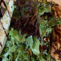 Grilled Salmon Salad · Spring mix topped with sliced almonds, dried cranberries, Gorgonzola cheese and kalamata oli...